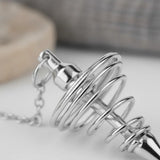 Péndulo Metal Espiral Plateado